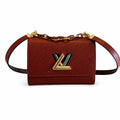 Louis Vuitton Twist Leather Gold Handbag