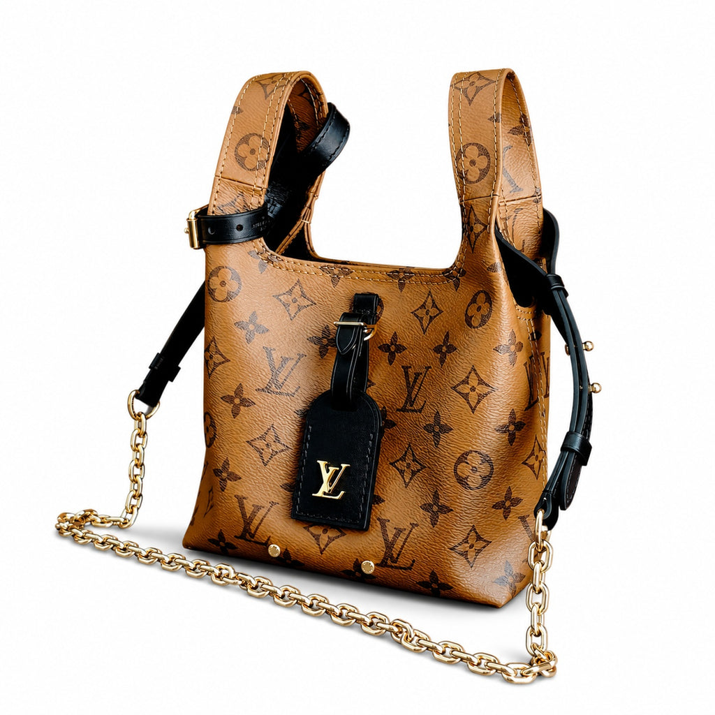 Louis Vuitton Atlantis Canvas Leather Handbag